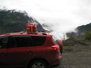 hyder-road-car-brownie Brownie sitting on top of the car in Hyder, Alaska